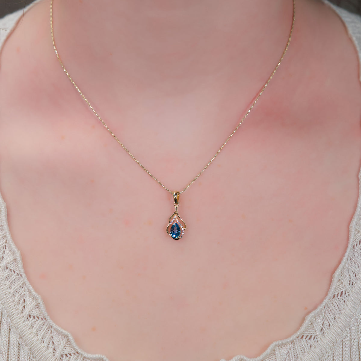 14kt Yellow Gold Swirl & .77 ct Blue Topaz with Diamond Accent Pendant