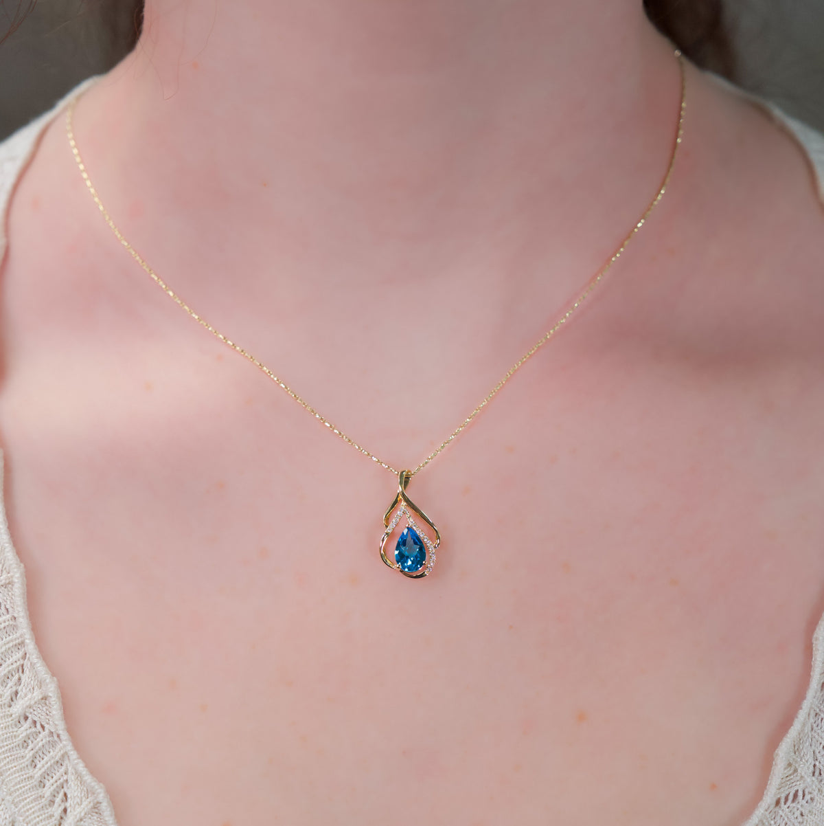 14kt Yellow Gold Swirl & 1.31 ct Blue Topaz with Diamond Accent Pendant