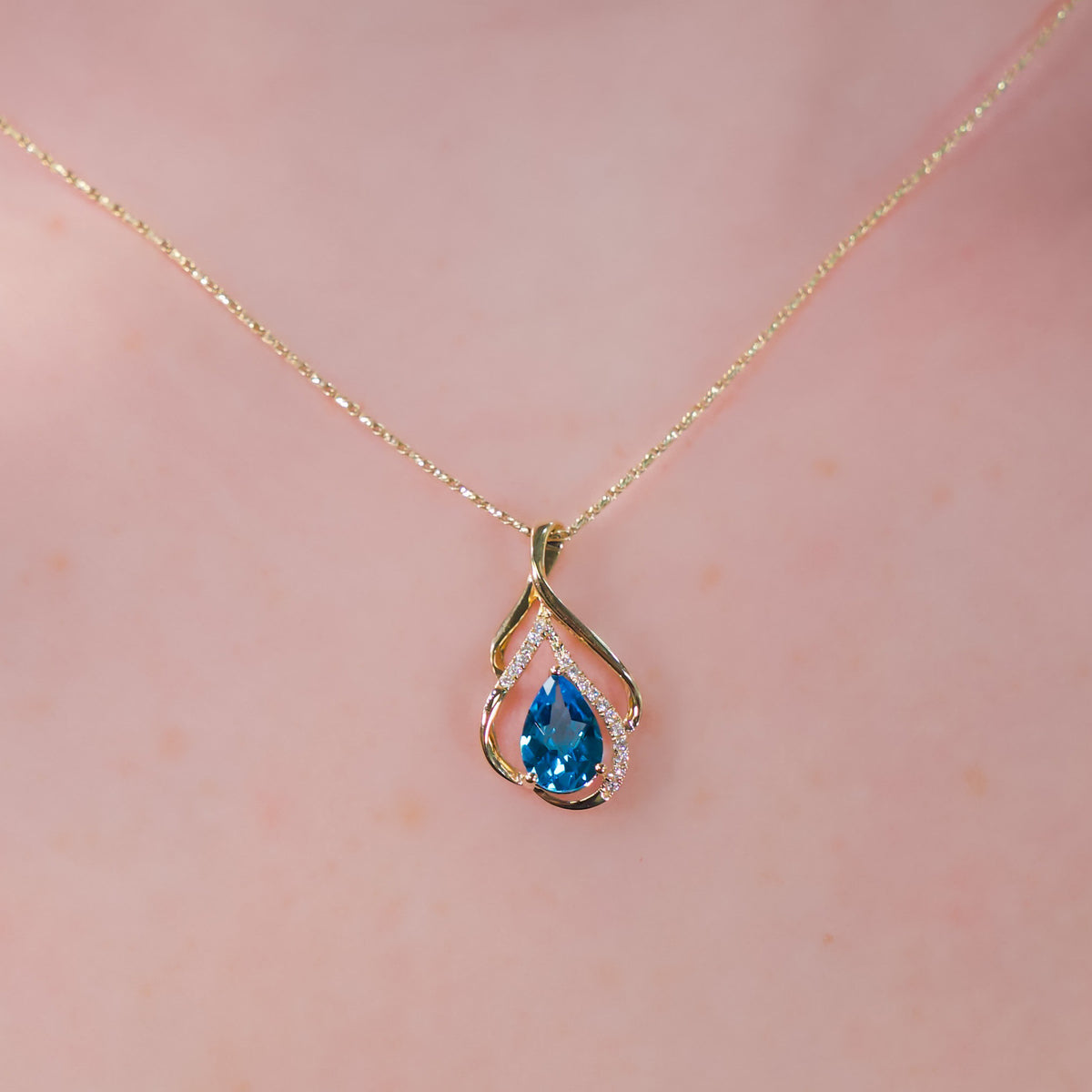 14kt Yellow Gold Swirl & 1.31 ct Blue Topaz with Diamond Accent Pendant